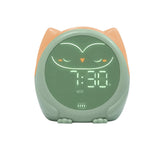 Green children's alarm clock with a owl design on a white background
